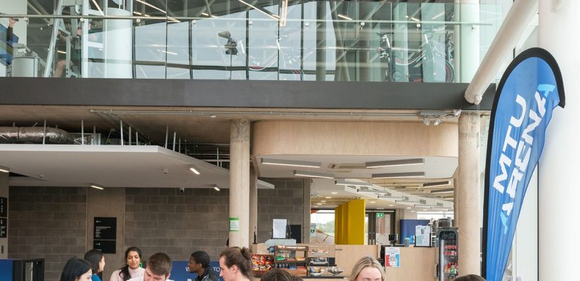 entrance hall students eat drink chat